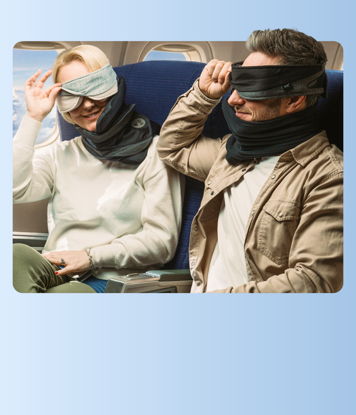 Couple using TRTL travel pillows on airplane